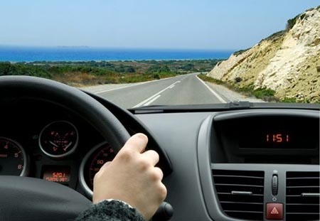 Driver enjoying a road trip in a rental car